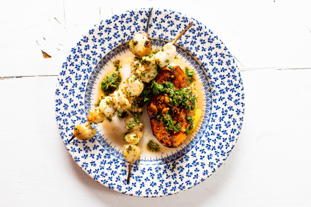 Grilled shrimp and scallop skewers with roasted butternut squash and chimichurri