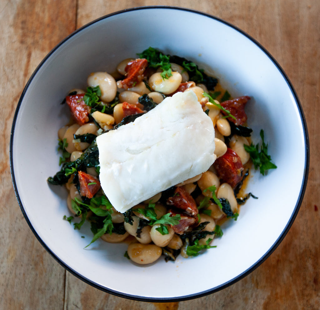 Cod loin with chorizo, butter beans and cavolo nero.